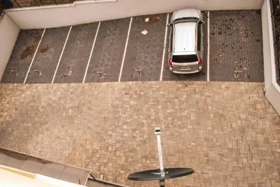 an overhead view of a parking lot with a car at Apartman Soko in Soko Banja