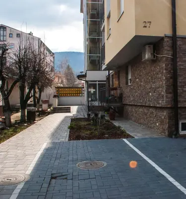 an empty street in front of a building at Apartman Soko in Soko Banja