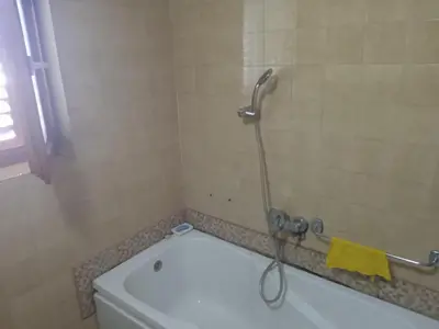 a shower in a bathroom with a toilet at Sobe Nevenka in Vrnjačka Banja