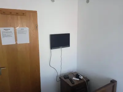 a room with a flat screen tv on a wall at Sobe Nevenka in Vrnjačka Banja