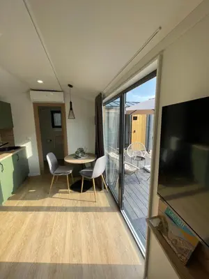 a living room with a view of a balcony at Kapija Svrljiga in Svrljig