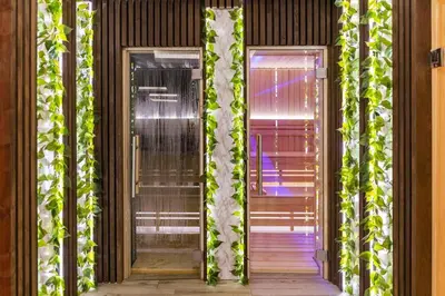 a building with two doors with ivy on it at Milmari boutique S3 lux in Kopaonik