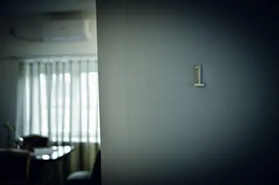 a door with a number one on it in a room at Radman's house in Niš