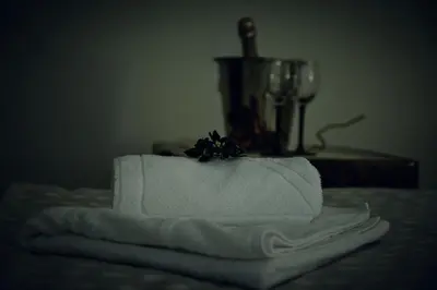 a pile of towels on a table with a blender at Radman's house in Niš