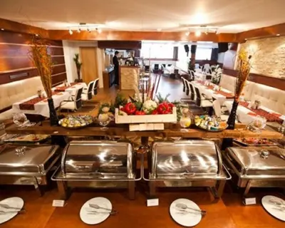 a buffet line in a hotel room with food at Apartman Planinski raj in Kopaonik