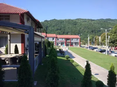 a view of a small town with a park at Motel Predejane in Predejane