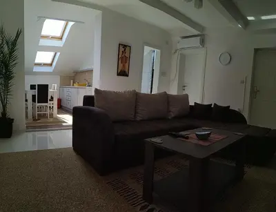 a living room with a couch and a table at BC Apartments in Niš