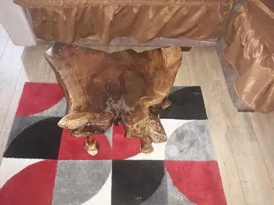 a wooden coffee table sitting on top of a rug at Iznad Oblaka1 Apartment PA-JO in Kopaonik