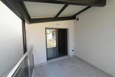 an empty room with a door and a window at VIR Villa in Kruševac