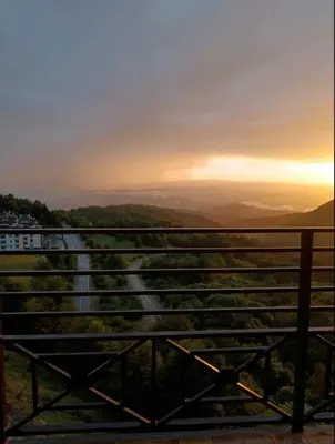 a view of a dirt road at sunset at Apartment S&A Milmari Resort S43 in Kopaonik
