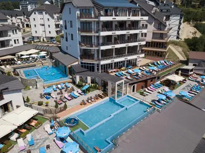 an aerial view of a hotel with a swimming pool at Milmari Resort & Spa Suites in Kopaonik