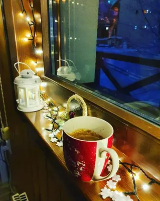 a cup of coffee sitting on a window sill at Sunrise apartmani in Kopaonik