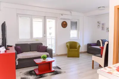 a living room with a couch and a table at Apartman Saga Premium Garaza Parking Vauceri Ne in Soko Banja