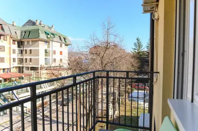 a balcony with a view of a building at Apartman Saga Premium Garaza Parking Vauceri Ne in Soko Banja