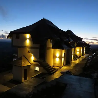 a small building with lights on it at night at Dvori E11 Hilltop in Kopaonik