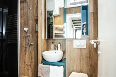 a bathroom with a sink and a mirror at Srebrna Petica in Kopaonik