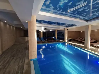 a swimming pool in a hotel with a ceiling at L18 apartment Milmari in Kopaonik