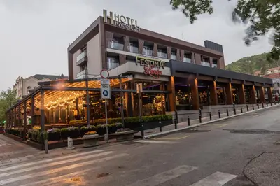 a building with a hotel on the side of a street at Hammeum Hotel in Prokuplje