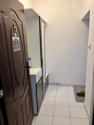 a door in a hallway with a tile floor at apartman centar S in Pirot