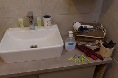 a white sink sitting on top of a counter at Premier 29 Milmari Resort Wellness&Spa in Kopaonik