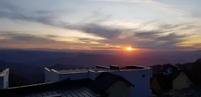 a view of the sunset from the roof of a building at Premier 29 Milmari Resort Wellness&Spa in Kopaonik