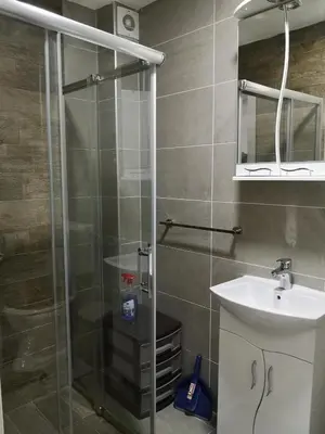 a bathroom with a shower and a sink at Apartman Downtown in Vrnjačka Banja