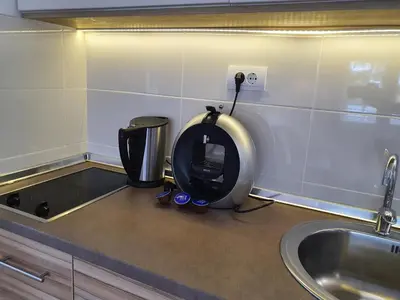 a kitchen counter with a juicer and a sink at Vila Plan centar Kopaonik in Kopaonik