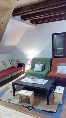 a living room with a couch and a coffee table at Sky 3 in Kopaonik