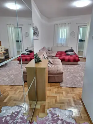 a living room with a couch and a table at Vila Košuta - Kopaonik, Brzeće 30m from gondola in Brzeće