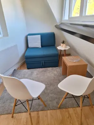 a living room with a blue couch and two chairs at Vila Košuta - Kopaonik, Brzeće 30m from gondola in Brzeće