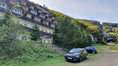 two cars parked in front of a building at Vila Košuta - Kopaonik, Brzeće 30m from gondola in Brzeće