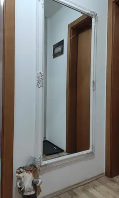 a mirror on a wall in a room at Apartman Beker Vrnjacka Banja in Vrnjačka Banja