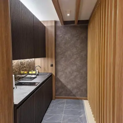 a kitchen with a sink and a counter top at Select Lux Woodside Residences & SPA in Kopaonik