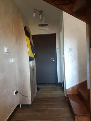 a hallway with a room with a door and a room with a room at Apartman Tea in Kopaonik