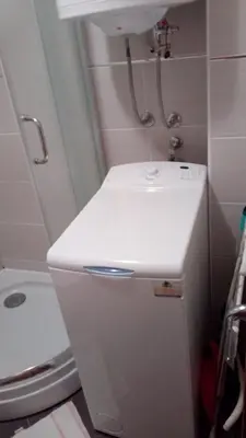 a small bathroom with a sink and a toilet at FEEL LIKE HOME in Vrnjačka Banja