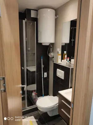 a bathroom with a toilet and a glass shower at Vila Irina - Studio 11 lux in Kopaonik
