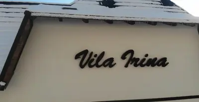 a sign on the side of a building with snow on it at Vila Irina - Studio 11 lux in Kopaonik