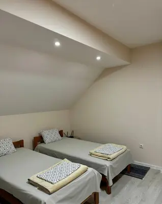 a room with two beds in a attic at Apartment 
