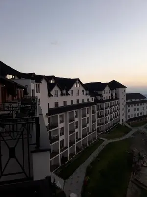 arial view of a large building with a yard at AMI apartman Kopaonik in Kopaonik