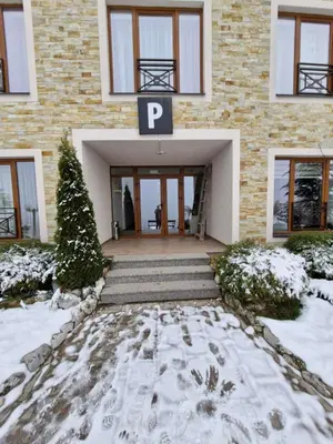a building with a letter p on it in the snow at Milmari P39 Kopaonik in Kopaonik