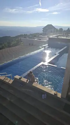 a person swimming in a swimming pool at Milmari P39 Kopaonik in Kopaonik