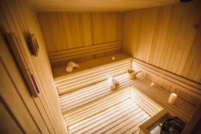 a wooden sauna with two teddy bears in it at Silver Kop apartmani in Kopaonik