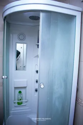 a shower with a glass door in a bathroom at Dusko dugousko in Niš
