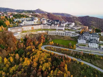 an aerial view of a city with trees and buildings at Panorama Apartman - Milmari L47 in Kopaonik