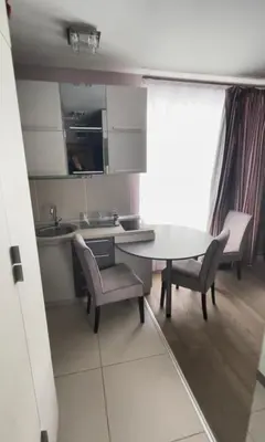 a kitchen and dining room with a table and chairs at Kopaonik apartmani u Kraljevim Čardacima , Čar 27 i 6-13 in Kopaonik