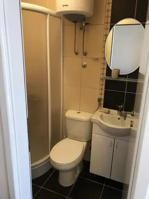 a small bathroom with a toilet and a sink at Kopaonik apartmani u Kraljevim Čardacima , Čar 27 i 6-13 in Kopaonik