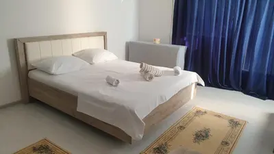 a bedroom with a bed with two stuffed animals on it at Apartman Sava in Niš