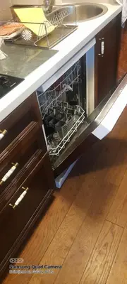a dishwasher with dishes in it in a kitchen at Like Home Lux, Apartman A9 in Kopaonik