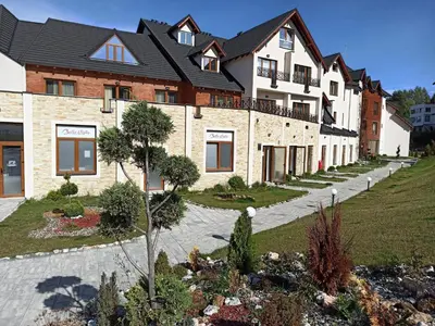 a house with a garden in front of it at Milmari S30 in Kopaonik