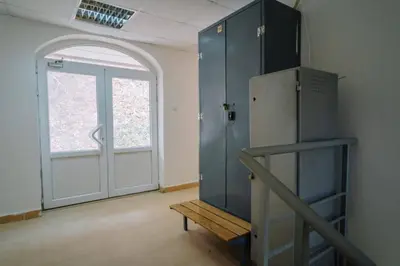 an empty room with a refrigerator and a door at Košuta 21 Center Duplex Apartment, Brzeće in Brzeće